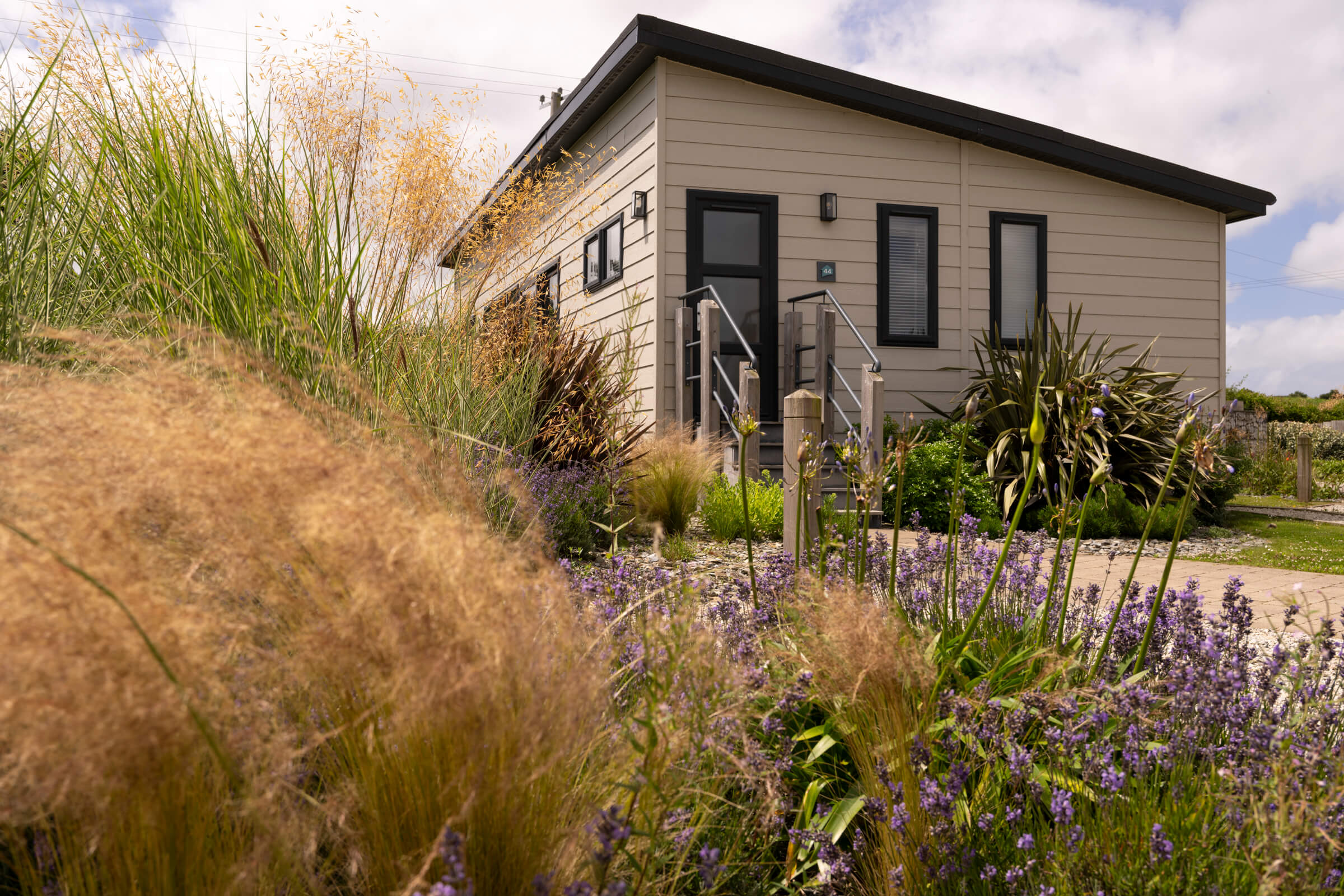 coastal grasses and lodge exterior at St Mabyn Cornwall