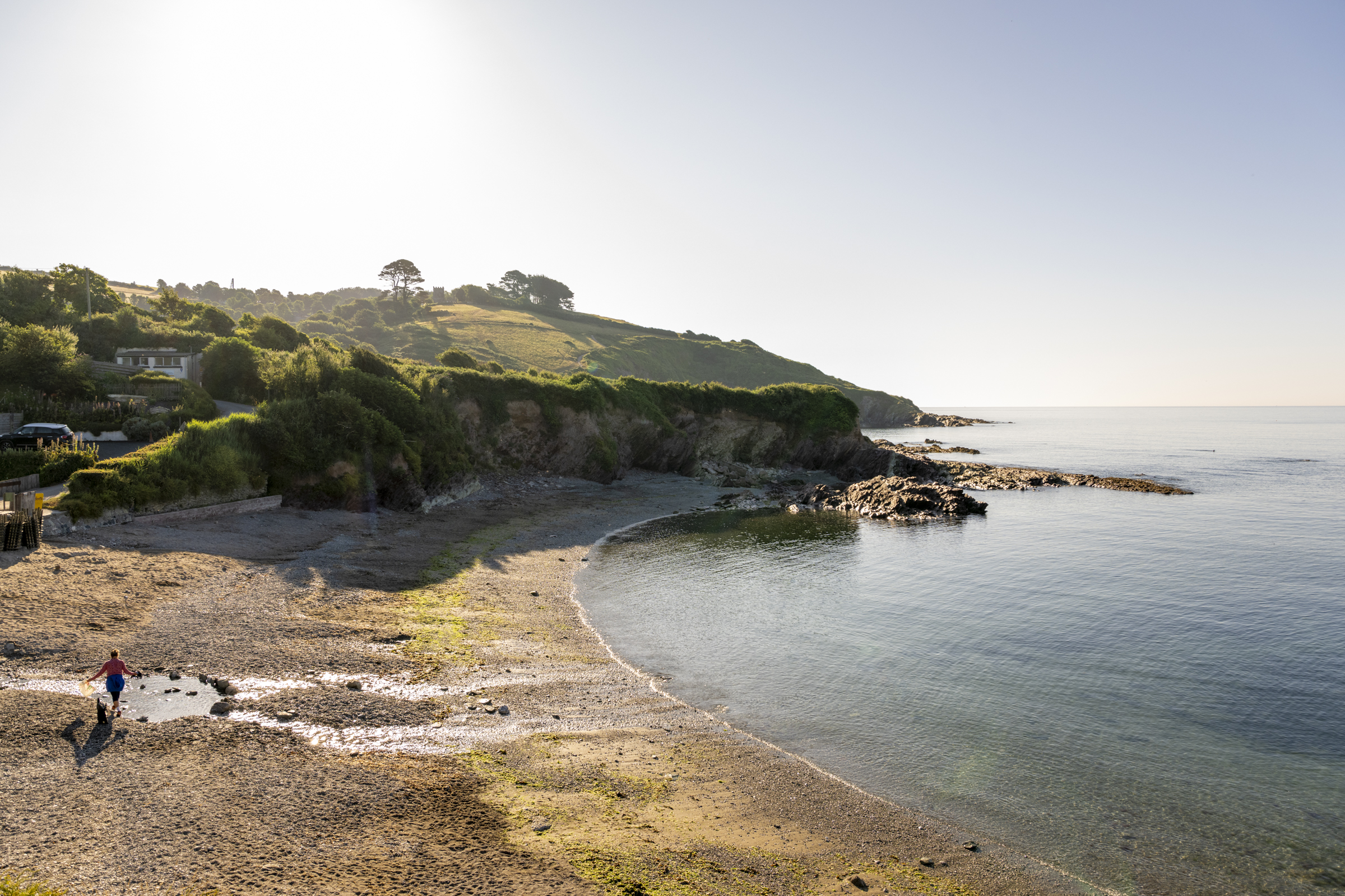 Talland Bay ariel view with woman on beach
